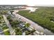 Aerial view of waterfront homes surrounded by lush greenery and waterways in a residential neighborhood at 4157 Marine Pkwy, New Port Richey, FL 34652