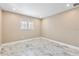 Bright room featuring a large window and stunning marble-look tile flooring at 4157 Marine Pkwy, New Port Richey, FL 34652
