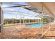 Screened in pool and brick patio overlooking boat lift and canal at 4157 Marine Pkwy, New Port Richey, FL 34652