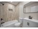 Well-lit bathroom featuring shower over tub, vanity, and neutral finishes at 4441 16Th N St, St Petersburg, FL 33703