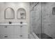 Contemporary bathroom featuring dual vanity, marble countertop, and tiled shower at 4441 16Th N St, St Petersburg, FL 33703