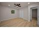 Comfortable bedroom with ceiling fan, closet, and wood-look flooring at 4441 16Th N St, St Petersburg, FL 33703