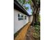 Exterior view of the house featuring updated paint, windows, and landscaping at 4441 16Th N St, St Petersburg, FL 33703