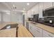 Well-lit kitchen with stainless steel appliances and granite countertops at 4441 16Th N St, St Petersburg, FL 33703