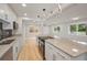 Open kitchen featuring a large island with granite countertops and pendant lighting at 4441 16Th N St, St Petersburg, FL 33703