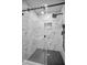 Modern tiled shower featuring black accents and glass doors at 4441 16Th N St, St Petersburg, FL 33703