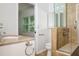 Bathroom with updated vanity, walk-in shower and decorative tile at 4611 W 18Th Ave, Bradenton, FL 34209