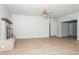Living room with brick fireplace, wood-look flooring, and an open floor plan at 4611 W 18Th Ave, Bradenton, FL 34209
