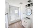 Newly remodeled bathroom with tiled shower and tub combo, modern vanity, and stylish lighting at 4701 17Th S Ave, St Petersburg, FL 33711