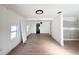Bright, open living room features new floors, fresh paint, and modern lighting fixtures at 4701 17Th S Ave, St Petersburg, FL 33711