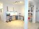 This bonus room has an art studio and a bookcase, with tile flooring at 4957 Seafoam Trl, Bradenton, FL 34211