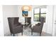 Dining area with seating for four features modern furnishings and natural light at 4957 Seafoam Trl, Bradenton, FL 34211