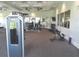 Spacious gym offers modern equipment, mirrored walls, and natural lighting, creating an ideal workout environment at 4957 Seafoam Trl, Bradenton, FL 34211