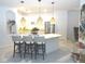 Modern eat-in kitchen featuring stainless steel appliances, granite countertops and a center island with pendant lighting at 4957 Seafoam Trl, Bradenton, FL 34211