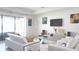 Bright living room features stylish furniture, natural lighting, and modern decor at 4957 Seafoam Trl, Bradenton, FL 34211