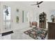 Bright foyer with neutral decor, white walls, decorative rug, and ample natural light at 5006 W Idaho St, Tampa, FL 33616