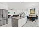 Open-concept kitchen flows to the living and dining areas, offering a social and inclusive living experience at 5006 W Idaho St, Tampa, FL 33616