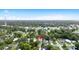 Aerial view of the home's location in a neighborhood with a dense tree canopy at 5055 9Th St, Zephyrhills, FL 33542