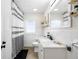 Bathroom featuring a shower with a striped curtain, tile accents, and stylish vanity at 5055 9Th St, Zephyrhills, FL 33542