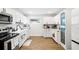 Modern kitchen with white cabinets, stainless steel appliances, and a stylish backsplash at 5055 9Th St, Zephyrhills, FL 33542