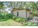 The backyard of the property includes a lush garden at 512 Pinewalk Dr, Brandon, FL 33510