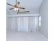 Bright, airy bedroom with vaulted ceiling, ceiling fan, and natural light from large window with curtains at 512 Pinewalk Dr, Brandon, FL 33510