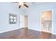 Light filled bedroom with ensuite bathroom features hard wood floors at 512 Pinewalk Dr, Brandon, FL 33510