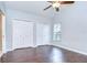 Spacious bedroom features wood floors and a large window overlooking the yard at 512 Pinewalk Dr, Brandon, FL 33510
