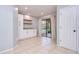 Bright dining area features tiled floors, built in cabinets, and a sliding glass door to the screened porch at 512 Pinewalk Dr, Brandon, FL 33510