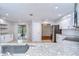 Modern kitchen featuring granite countertops, white cabinets, and stainless steel appliances at 512 Pinewalk Dr, Brandon, FL 33510