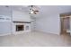 The living room has a striking white painted brick fireplace and tiled floors at 512 Pinewalk Dr, Brandon, FL 33510
