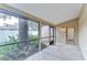 Relaxing screened-in porch offers a view of the garden at 512 Pinewalk Dr, Brandon, FL 33510