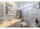 This bathroom features a tub/shower combo, white vanity, and a soothing color palette at 5706 Benton St, Zephyrhills, FL 33542
