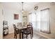 Charming dining area with wood table, pendant lighting, and decorative accents at 5706 Benton St, Zephyrhills, FL 33542