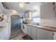 Bright kitchen boasts ample counter space, updated cabinets, and stainless-steel appliances at 5706 Benton St, Zephyrhills, FL 33542