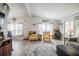 Bright living room with hardwood floors, ample seating, and stylish decor, creating a comfortable and inviting atmosphere at 5706 Benton St, Zephyrhills, FL 33542