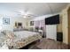 Relaxing main bedroom with large dresser, television, and decorative accents at 5706 Benton St, Zephyrhills, FL 33542