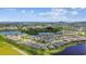 Expansive aerial perspective of homes and a community showcasing lakes and lush landscaping at 6211 Sea Air Dr, Apollo Beach, FL 33572
