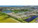 Panoramic aerial shot of a residential community featuring multiple homes, lakes, and green spaces at 6211 Sea Air Dr, Apollo Beach, FL 33572