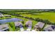 Overhead shot of homes with well-kept lawns and large green fields with trees; peaceful, serene neighborhood setting at 6211 Sea Air Dr, Apollo Beach, FL 33572