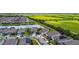 Community with a pond, large field, and sidewalks winding between manicured lawns and homes in a serene, suburban atmosphere at 6211 Sea Air Dr, Apollo Beach, FL 33572