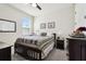 Cozy bedroom with a queen-sized bed, soft lighting, and a ceiling fan at 6211 Sea Air Dr, Apollo Beach, FL 33572