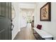 Bright foyer with tile flooring, bench, and a view of the living spaces beyond at 6211 Sea Air Dr, Apollo Beach, FL 33572