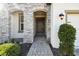 Inviting front entrance with a stone archway and well-maintained landscaping at 6211 Sea Air Dr, Apollo Beach, FL 33572