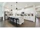 Spacious kitchen with white cabinets, stainless steel appliances, and center island with seating at 6211 Sea Air Dr, Apollo Beach, FL 33572