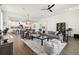 Spacious living room featuring an open layout, modern decor, and seamless flow into the kitchen and dining area at 6211 Sea Air Dr, Apollo Beach, FL 33572