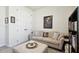 Cozy living room features a comfortable sofa, stylish decor, and closet for ample storage space at 6211 Sea Air Dr, Apollo Beach, FL 33572