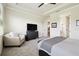 Inviting main bedroom features a soft chair, chest of drawers, and easy access to the en-suite bathroom at 6211 Sea Air Dr, Apollo Beach, FL 33572