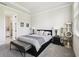 Comfortable main bedroom with neutral tones, including a gray carpet, cat tree, and decorative accent pieces at 6211 Sea Air Dr, Apollo Beach, FL 33572