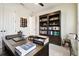 Spacious office with a large wooden bookcase and a comfortable workspace at 6211 Sea Air Dr, Apollo Beach, FL 33572